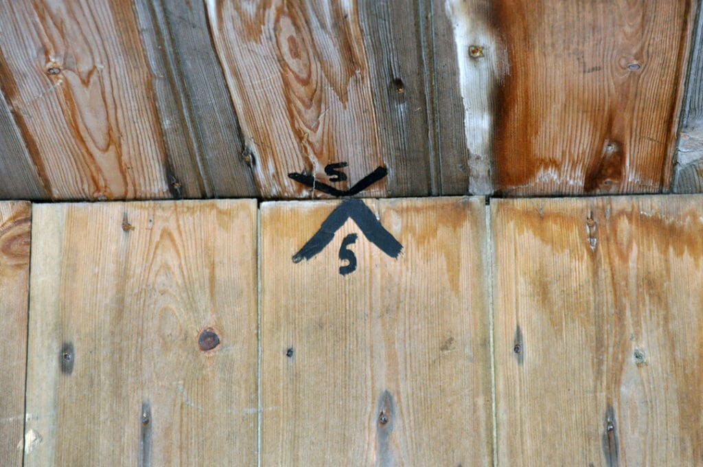 Wooden ceiling with abstract black symbol painted